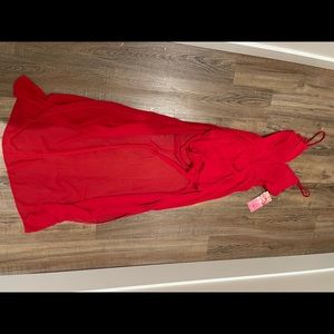 Red skort with open lace back and deep plunge